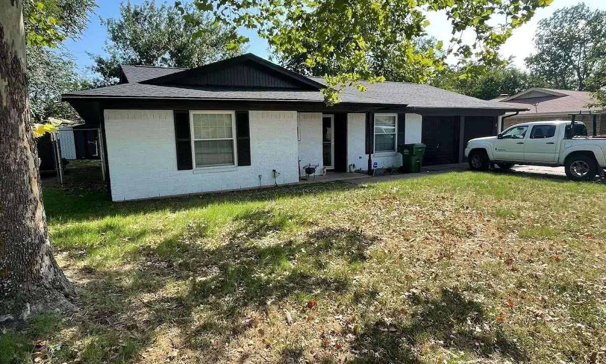 Professional roofing crew working on a residential roof in Fort Valley
